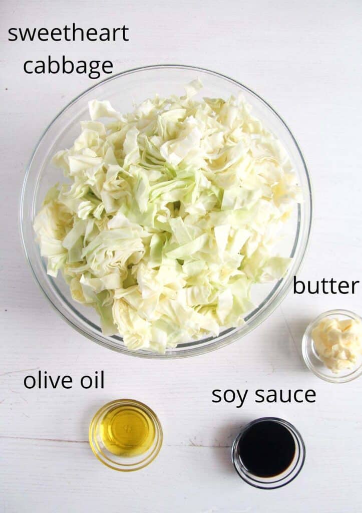 bowl of chopped cabbage, soy sauce, olive oil and butter.