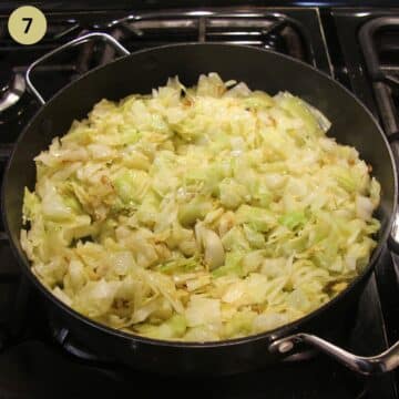 cooking sweetheart cabbage in a large pan on the stovetop.