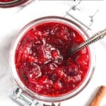 pinterest image of sauce with cranberries with title on it.