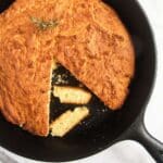 pinterest image of cornbread baked in a pan.
