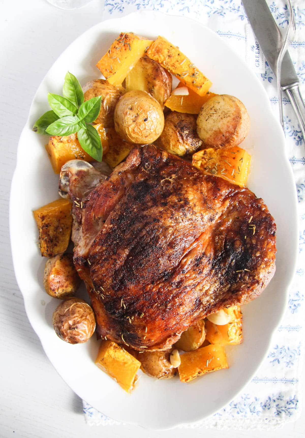 overhead view of crispy skin turkey piece served with potatoes.