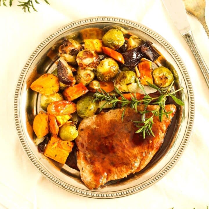 turkey chop recipe with balsamic sauce and roasted vegetables on a plate.