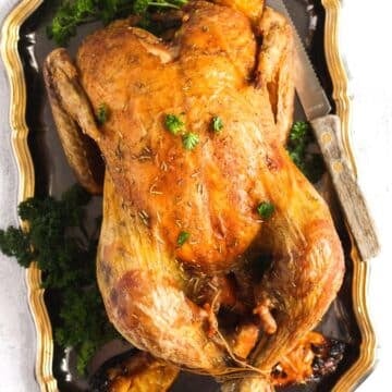 roasted christmas chicken sprinkled with parsley.