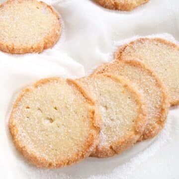 close up german heidesand cookies on white fabric.