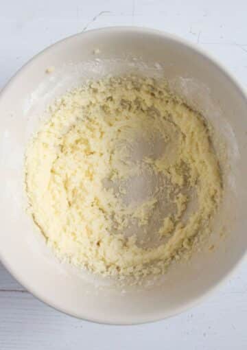 creaming butter and sugar in a bowl.