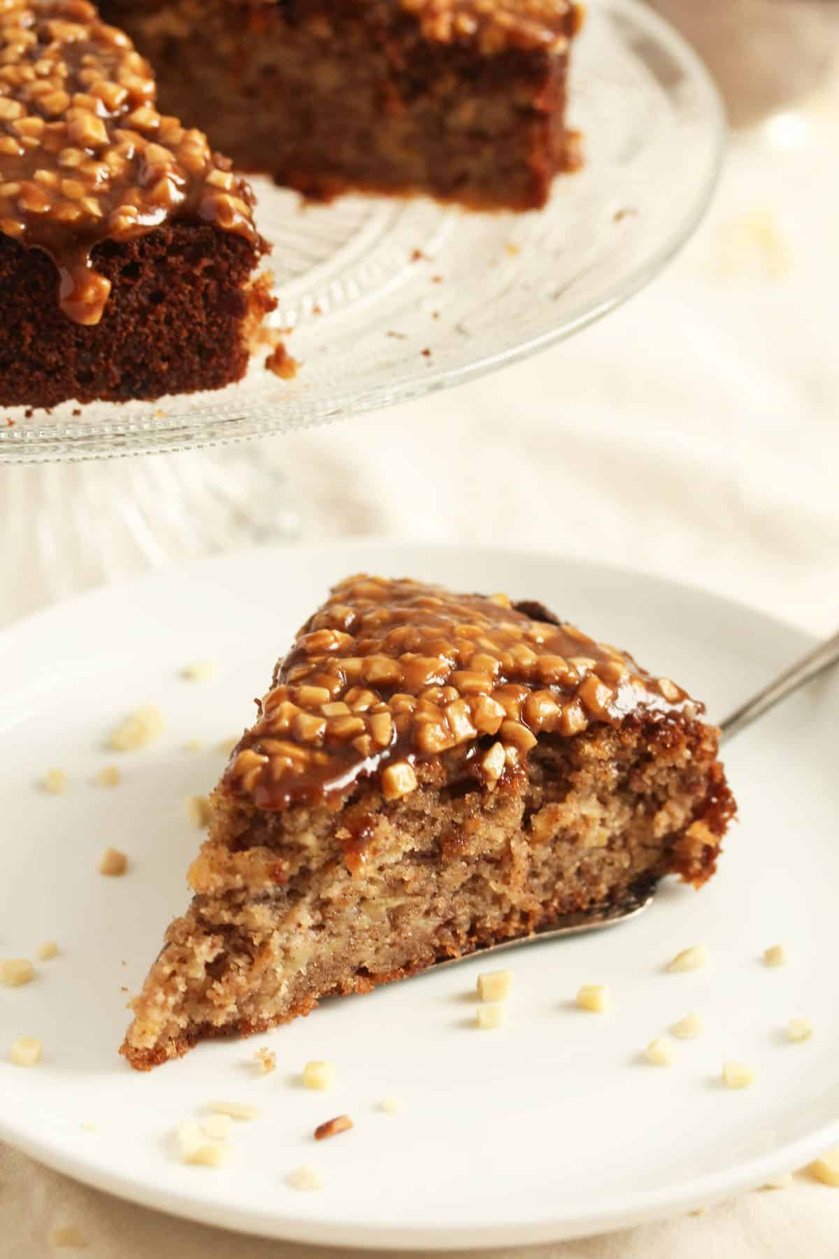 slice of spicy cake topped with sticky toffee sauce.