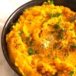 pinterest image of carrot and swede puree in a bowl.