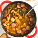 overhead view of swede soup in a red pot.