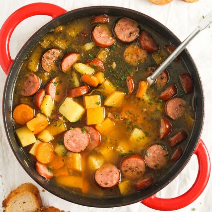 overhead view of swede soup in a red pot.