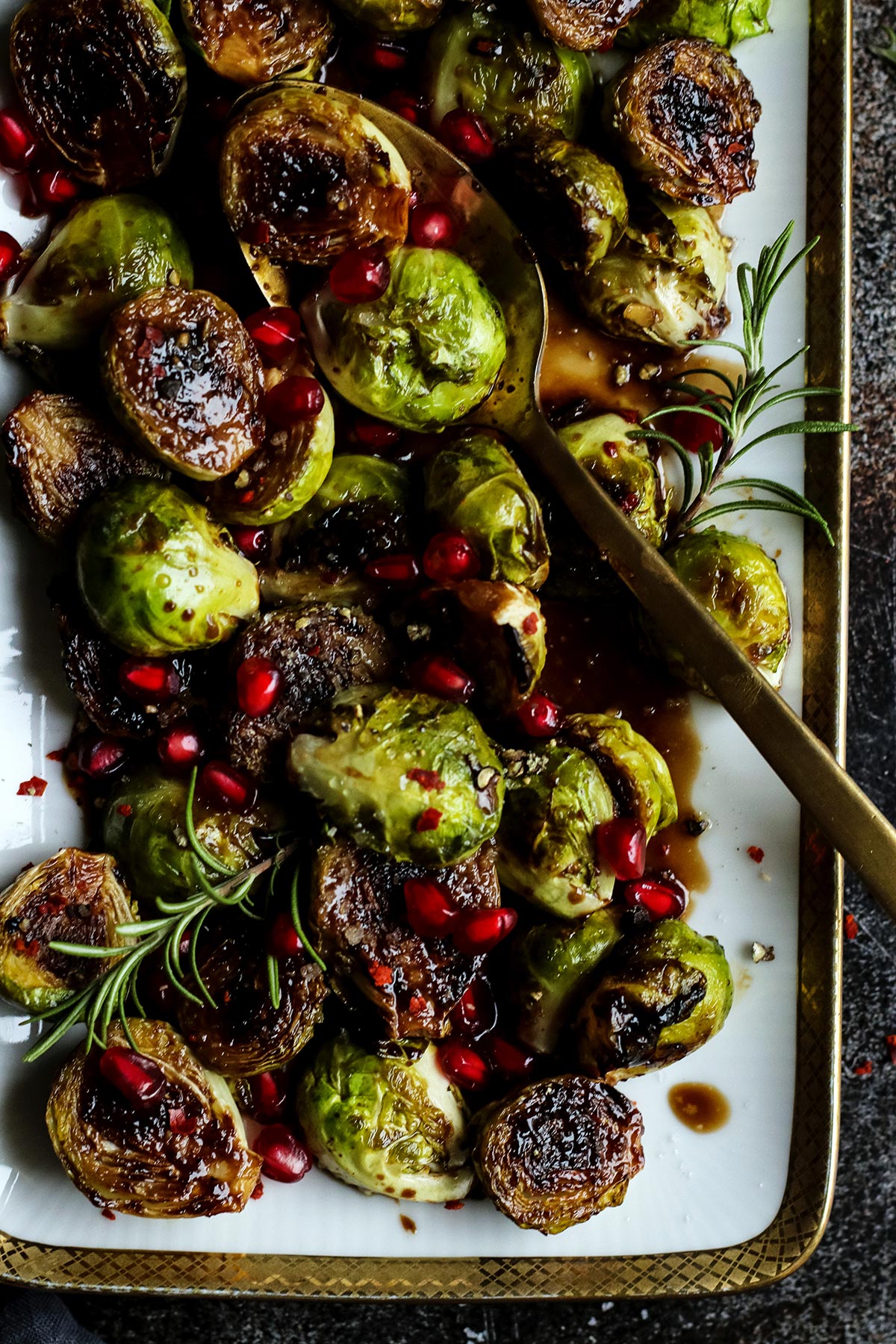 roasted brussels sprouts sprinkled with pomegranate seeds.