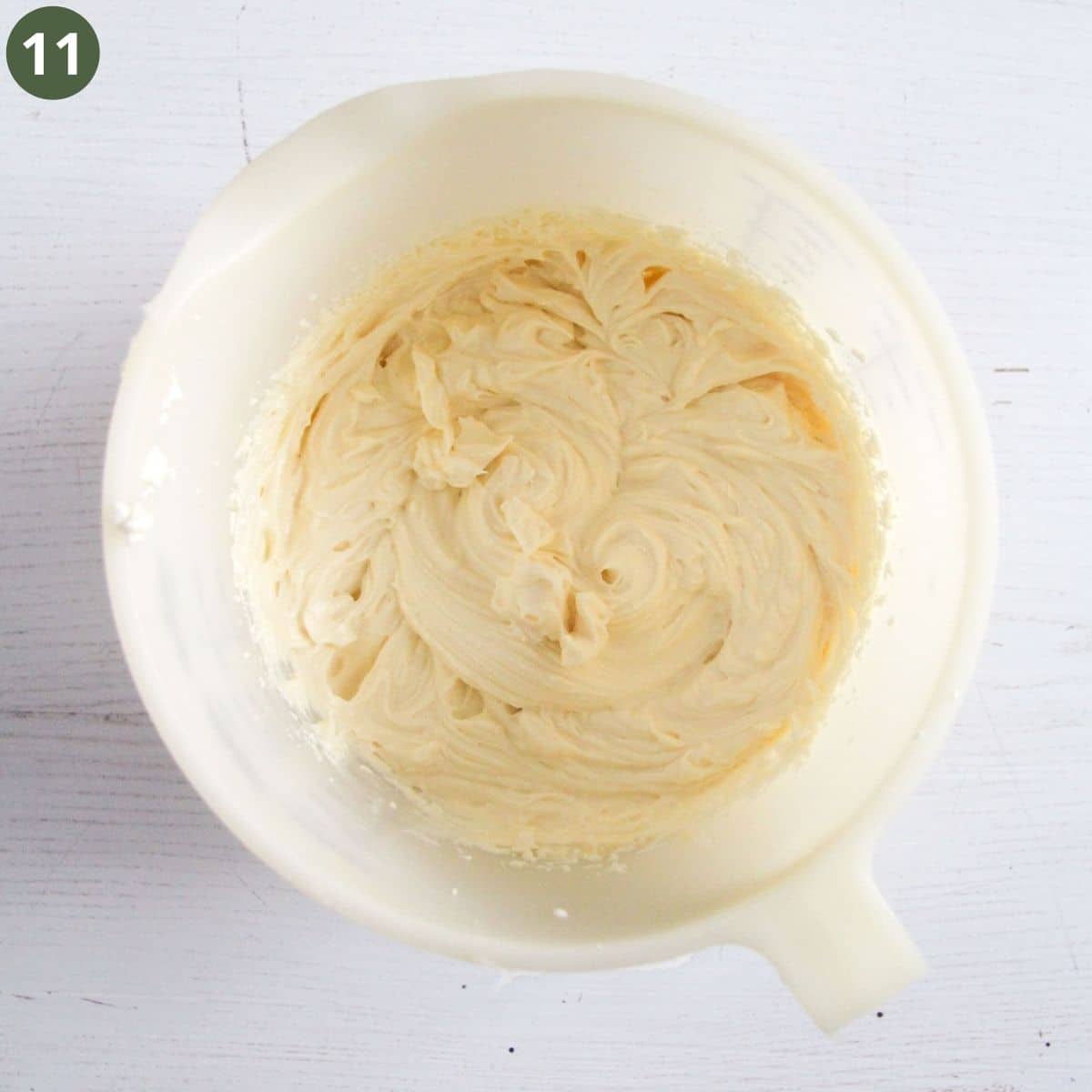 freshly whipped cream cheese frosting in a bowl.