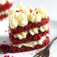 three layered mini cake with frosting.