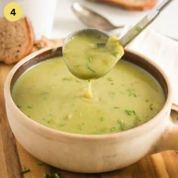 pouring irish potato soup with a soup ladle back into the pot.