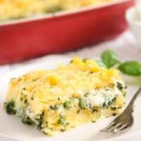 slice of polenta al forno with spinach on a plate.