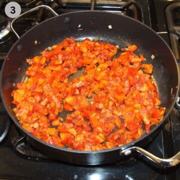 sauteing vegetables and tomato paste for stew in a pot