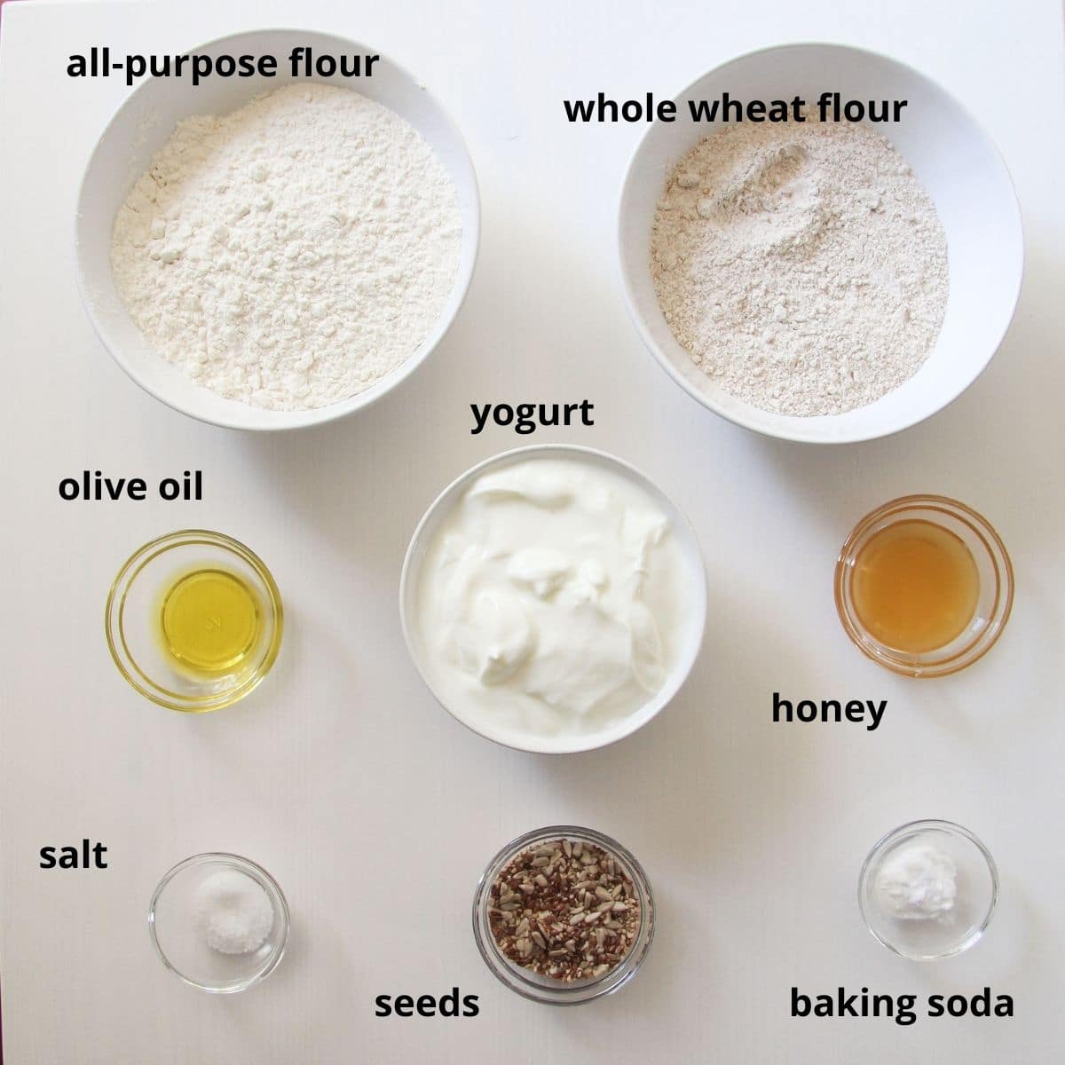 listed ingredients for making yogurt bread on the table.