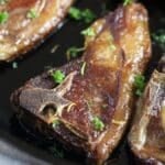 pinterest image with title of fried lamb chops.