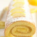 pinterest image of a roll filled with lemon curd.