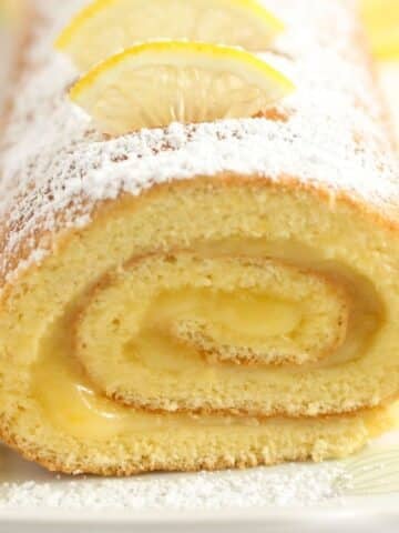 lemon roll cake showing the filling close up.
