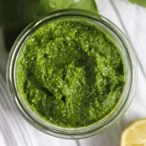 overhead view of a jar containing lovage pesto.