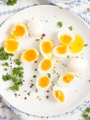 plate with tiny boiled quail eggs sprinkled with parsley.