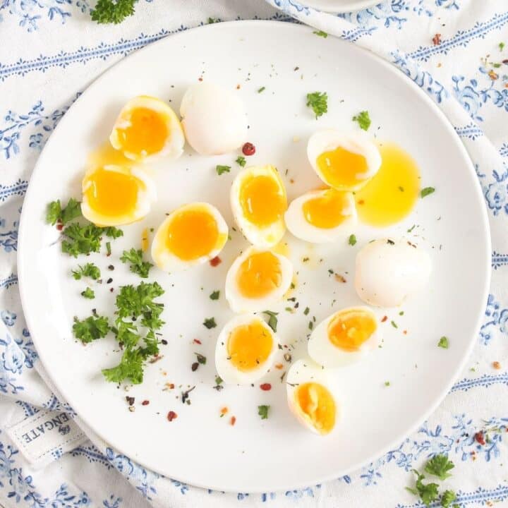 plate with tiny boiled quail eggs sprinkled with parsley.