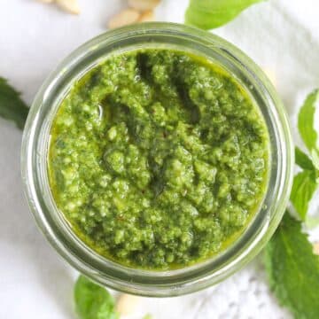 overhead view of jar with mint basil lemon pesto.