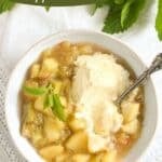 pinterest image of a bowl of stewed rhubarb with ice cream.