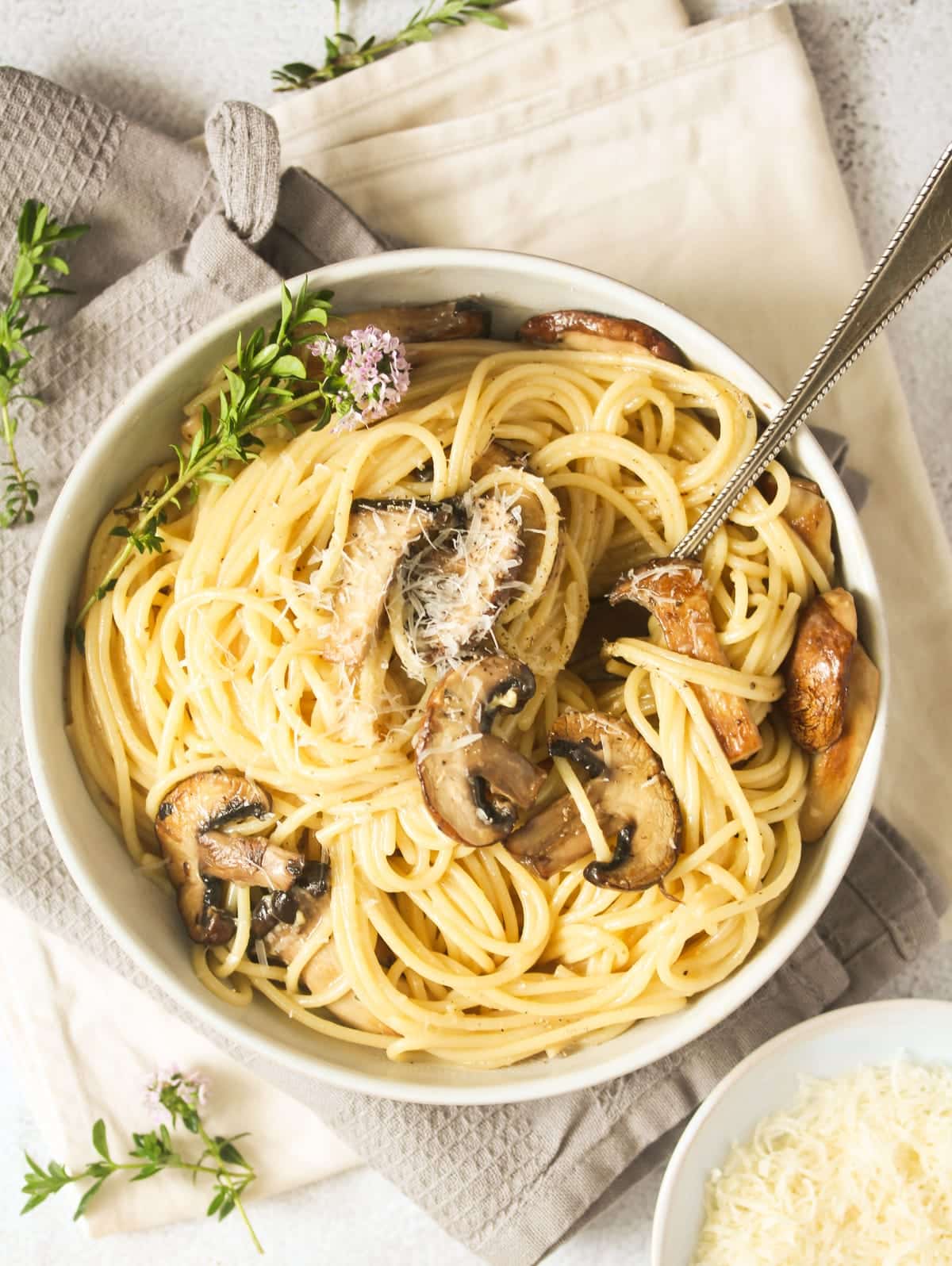 overhead view of a bowl of pasta with truffle oil.