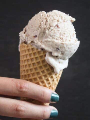 cherry amaretto ice cream in a cone.