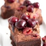 chocolate cherry brownies topped with fresh fruit.