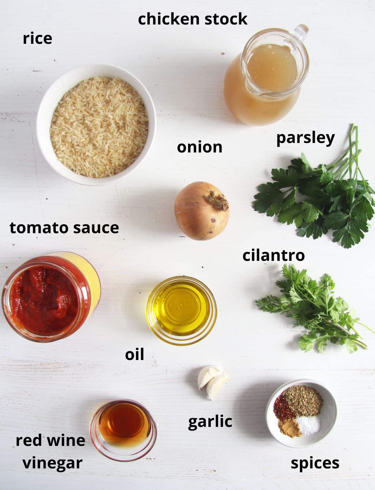 listed ingredients for cooking rice with tomato sauce and chimichurri.