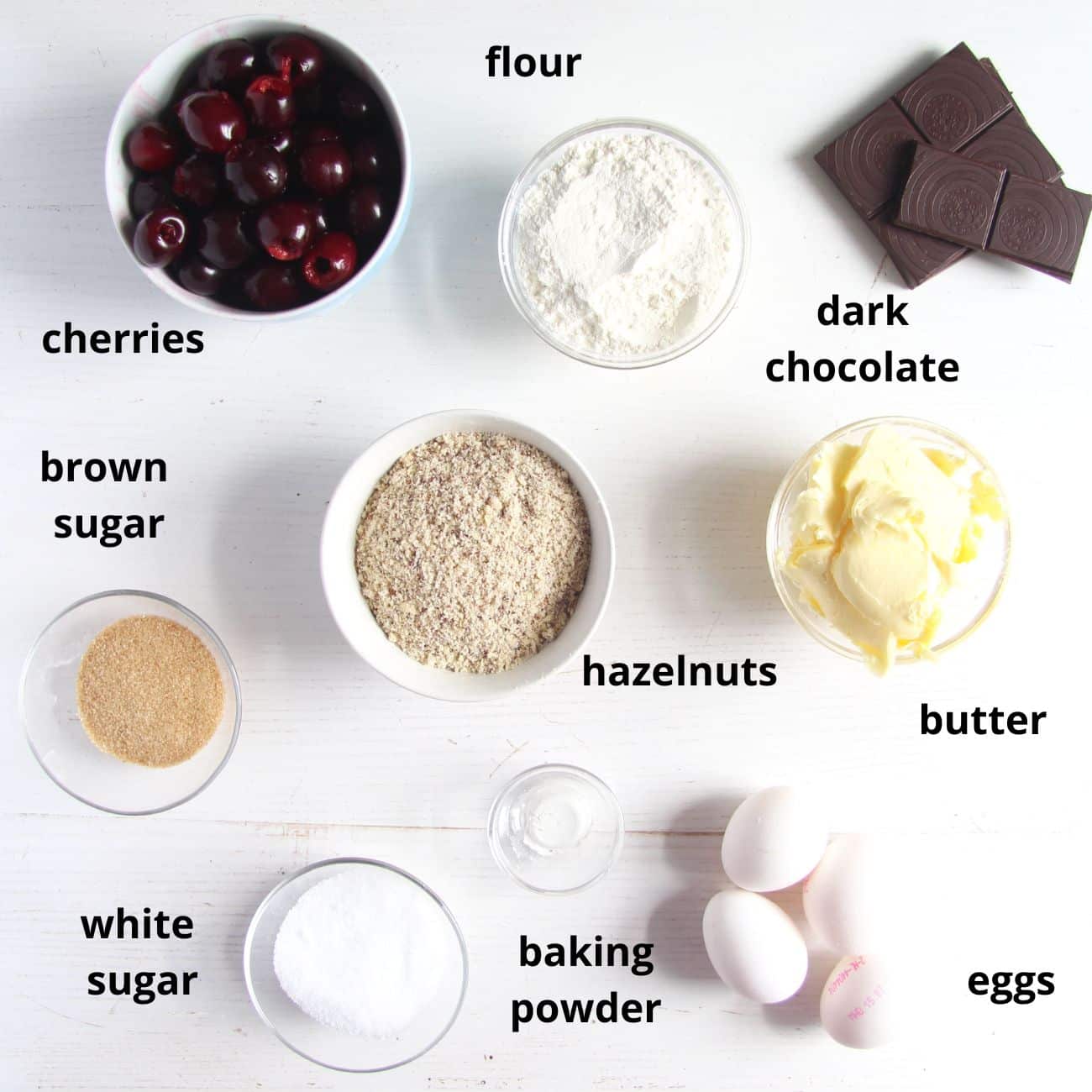 listed ingredients for chocolate cake with cherries.