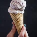 pinterest image with title of a cone of ice cream on a black background.