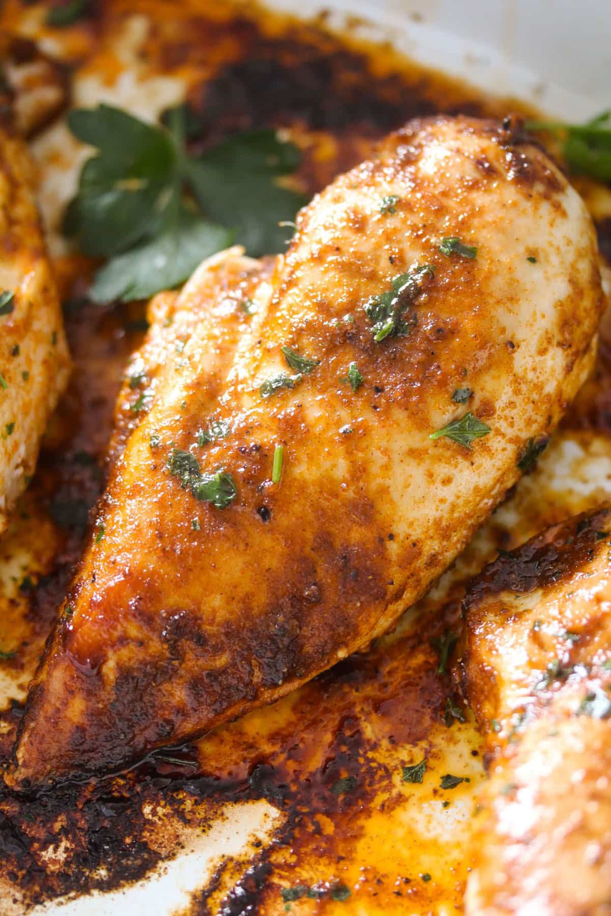 one large golden chicken breast cooked from frozen and sprinkled with parsley.