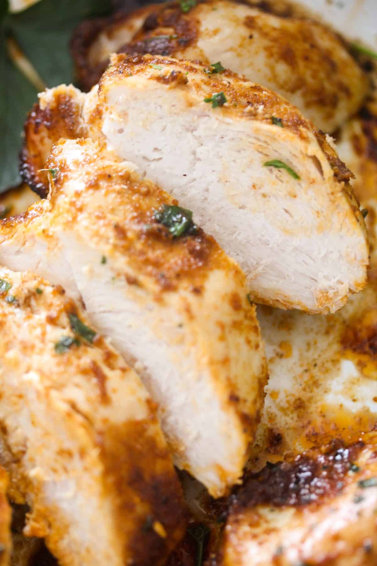 close up slices of baked chicken breast.
