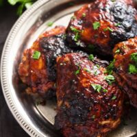 chicken thighs glazed with sticky sauce and baked.