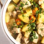 pinterest image with title of chicken and potato stew.
