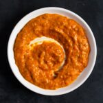 overhead view of peri peri sauce on a small plate.