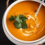 pinterest image with title of a bowl of soup with pumpkin and potatoes.
