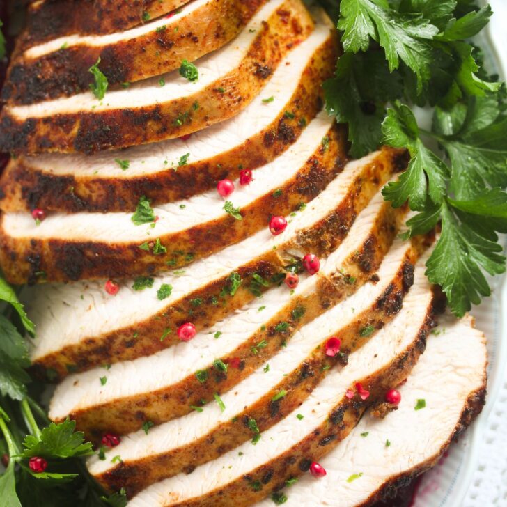 sliced roasted boneless skinless turkey breast close up.