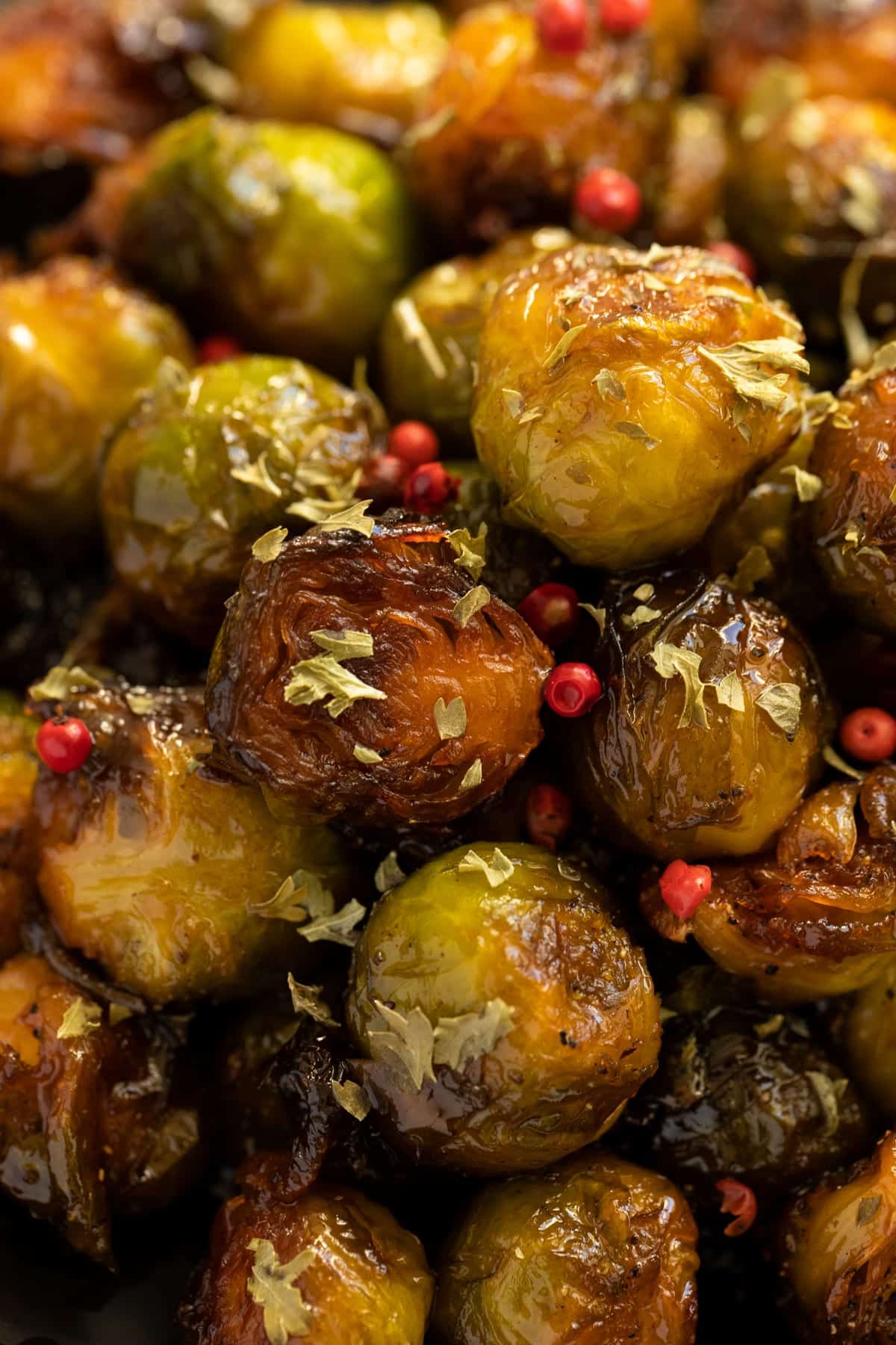 many caramelized sprouts sprinkled with red peppercorns,