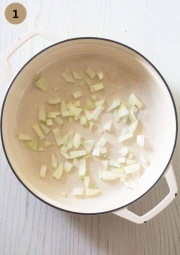 raw, chopped onions in a large pot for making pulled turkey.