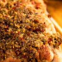 close up one turkey breast tenderloin crusted with Italian seasoning.