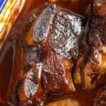 pinterest image with title of baked beef short ribs.