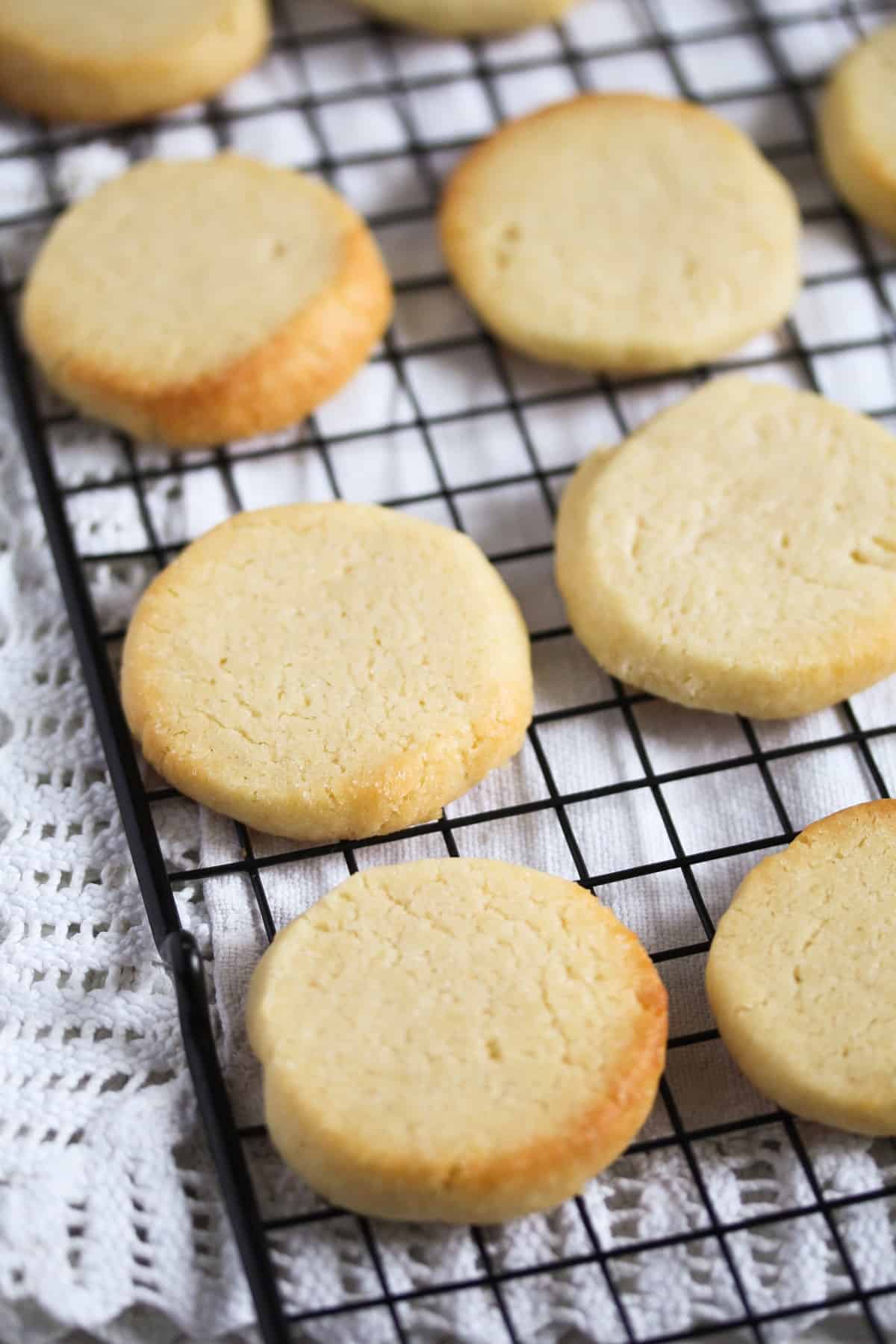 round golden biscuits cooling on a wire rack.