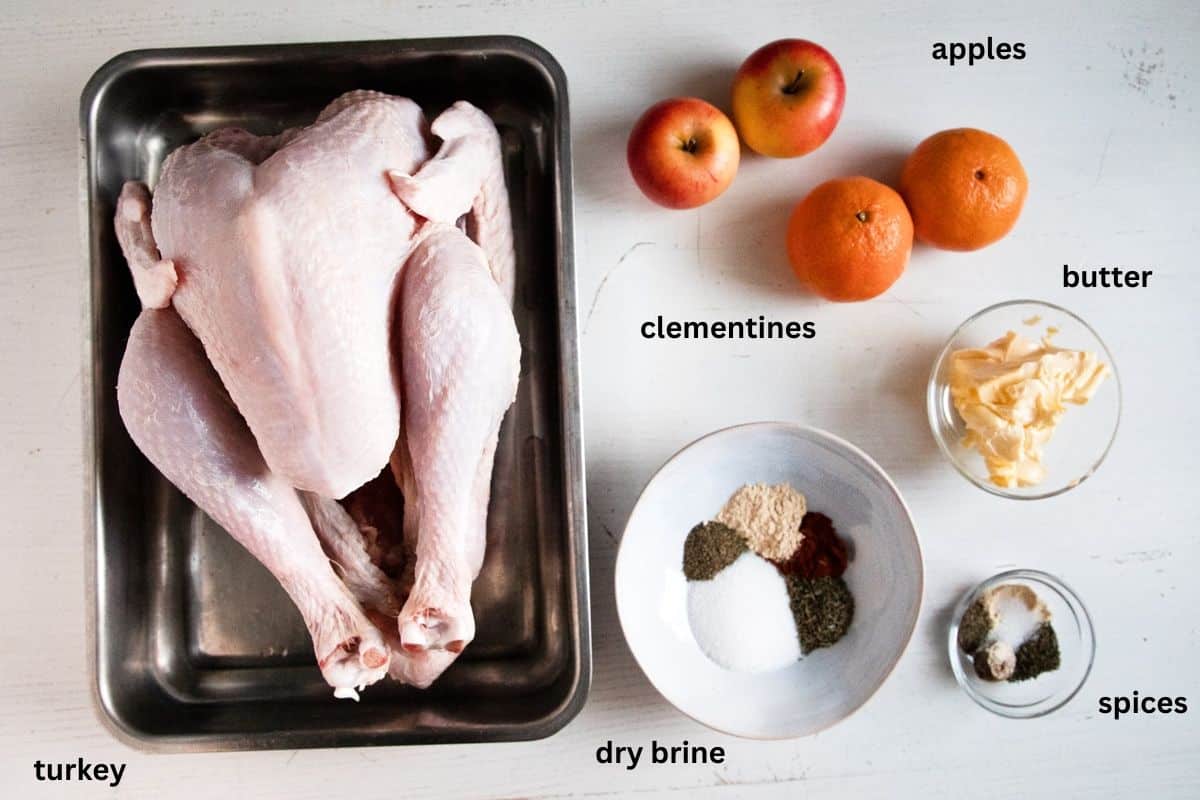 listed ingredients for cooking turkey with mandarins and apples.