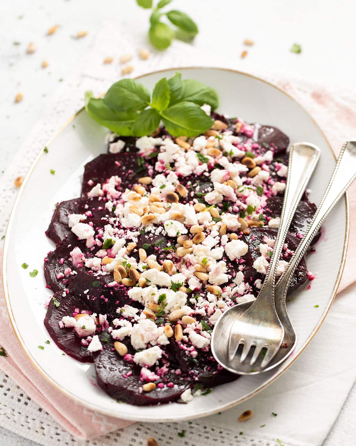 vintage platter with salad made with roasted beets, feta cheese, and balsamic vinegar.