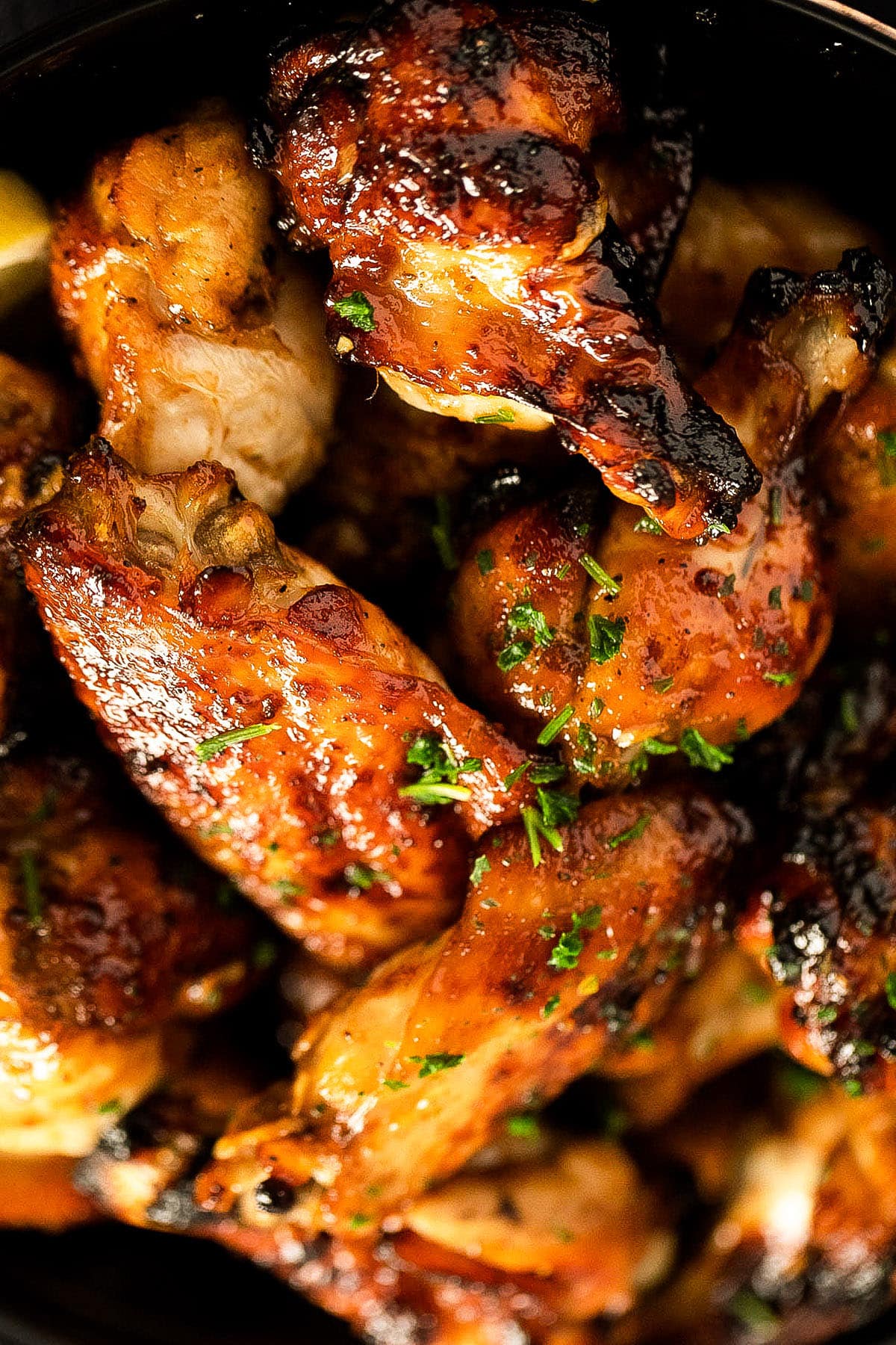 close up of a bunch of golden brown hot wings.