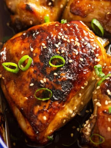 close up baked teriyaki chicken thighs in the oven.